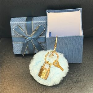 Louis Vuitton authentic Gold Padlock & Key - includes Blue Fur Pom Pom Keychain